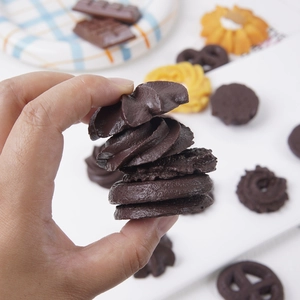 Realistic chocolate cookie miniatures set with spiral heart and pretzel shaped resin charms