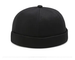 Side view of classic black cotton twill miki hat with six-panel minimalist construction