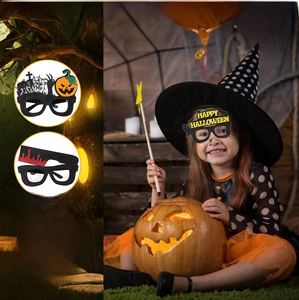 Detailed view of non-woven Halloween party eyewear featuring pumpkin and ghost designs