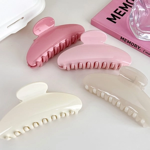 Set of four French style acrylic semicircular shark hair claws in assorted pink colors
