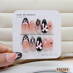 Handmade almond press-on nails featuring 3D pink bows, rhinestones, and heart patterns