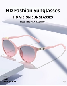 Detail of pink cat-eye sunglasses featuring unique hexagonal pattern on temples