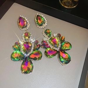 Macro shot of colorful teardrop dangling earrings with rhinestone edging and aurora crystal finish