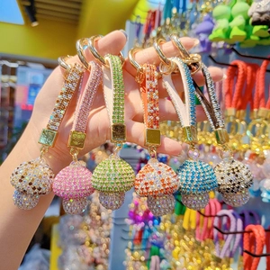 Sparkling crystal mushroom keychains in six vibrant colors with gold metal hooks and straps
