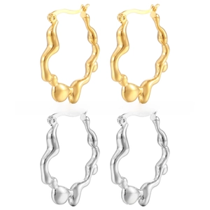 Irregular textured gold and silver hoop earrings with a wavy metal design