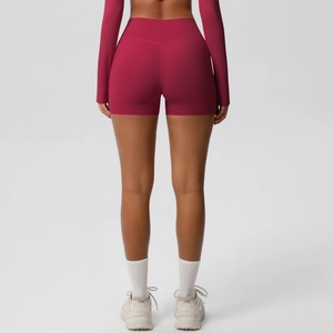 Rear view of high-waisted burgundy yoga shorts showing seamless butt-lifting design