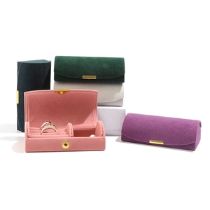 Velvet travel jewelry organizer boxes in multiple colors with gold clasps and ring slots