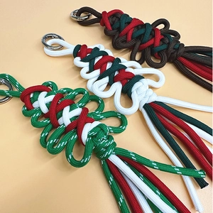 Handmade woven Christmas tree keychains in red, green and white festive colors