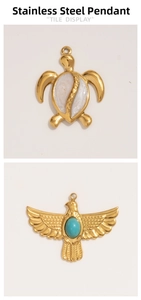 Detail of stainless steel turtle and eagle pendants with turquoise and marble inlays
