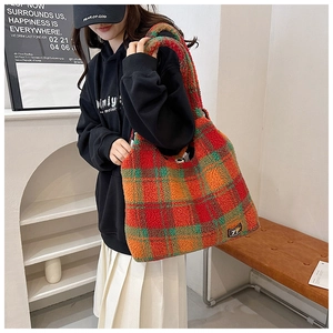 Close-up of large plush plaid tote bag with soft fleece texture and colorful pattern