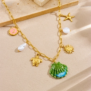 Gold stainless steel ocean necklace with turtle, starfish, shell and pearl charms