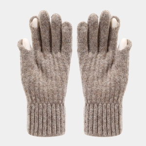 Detail of knitted gloves featuring touchscreen fingertip openings and ribbed cuffs