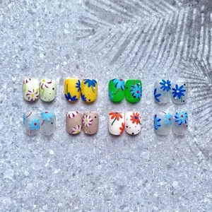 Floral nail art stickers with daisies and dots in yellow, green, and blue matte finish