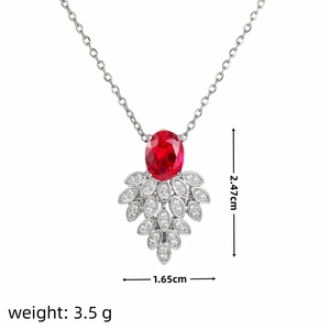 Detail view of oval red gem pendant with white zircon leaf accents and size dimensions
