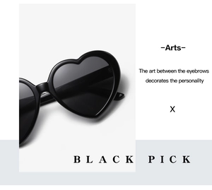 Side view detail of black heart-shaped sunglasses with polished frames and model ES117