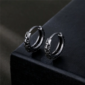 Vintage punk titanium steel hoop earrings with hollow carved texture in retro silver finish