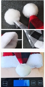 Close-up of red and black plaid Christmas pet hat showing plush texture and elastic strap