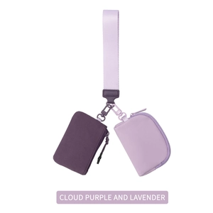 Close-up of waterproof nylon wristlet pouches in cloud purple and lavender color tones