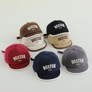 Multi-color stack of cotton baby baseball caps with Boston embroidery and soft brims