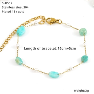 Detail view of 18k gold-plated stainless steel bracelet with blue stones and pearls