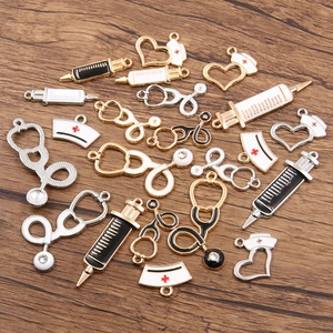 Macro view of medical charms featuring alloy stethoscopes and syringes on wood