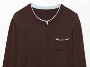 Detail view of coffee brown knit cardigan with blue trim and single chest pocket