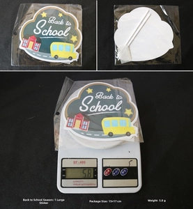 Detail view of Back to School cake topper with 15x17cm dimensions and weight on scale