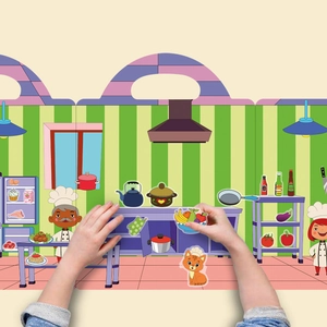 Detail of reusable cooking scene stickers being placed on a play kitchen background board