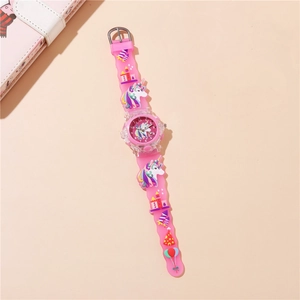 Detailed view of pink unicorn kids watch with 3D embossed silicone strap and castle motif