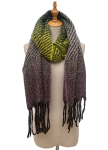 Detail of gradient autumn knit scarf with herringbone weave pattern and long fringe trim