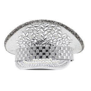 Detail of silver sequins, rhinestones, and pearls on a white punk performance hat
