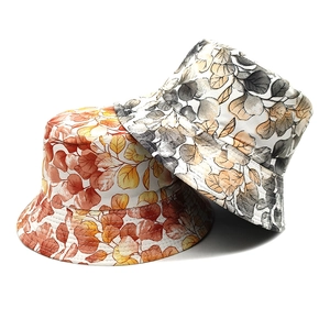 Double-sided reversible bucket hat with plant leaf prints in autumn and cool color tones