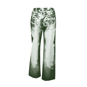 Detail of green and white abstract bleach spray print on wide-leg casual pants
