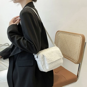 White faux shearling crossbody bag for women with a minimalist winter design