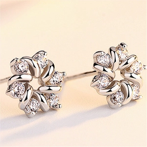 Elegant rotating flower stud earrings with sparkling zircon crystals in silver finish