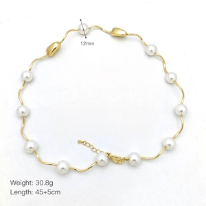Detail of 18k gold plated wave chain with 12mm pearls and lobster clasp closure