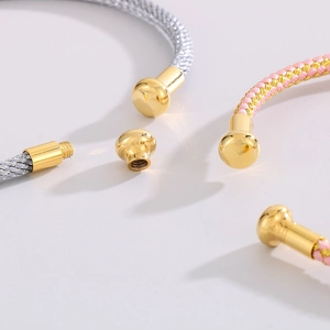 Detail of woven rope bracelets with gold screw-end caps and DIY modular design