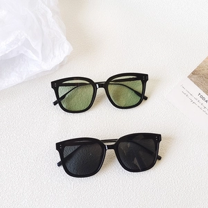 Retro square frame sunglasses in black acetate with green and dark grey tinted lenses