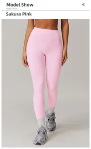 Close-up of high-waist yoga leggings in cherry blossom pink with seamless matte fabric
