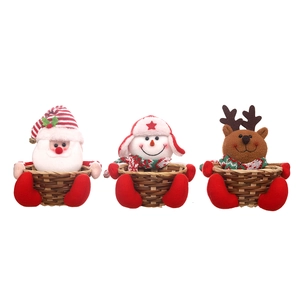 Three Christmas candy baskets with Santa, snowman, and reindeer characters for table decor