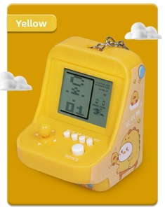 Mini retro handheld yellow arcade game keychain with decorative cartoon stickers