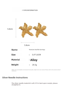 Macro detail of large gold starfish earrings showing textured metal surface and 5.8cm size