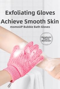 Detail of pink exfoliating bath glove with rich soap lather on a textured surface