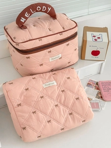 Pink quilted cosmetic bag set with strawberry bow embroidery and top handle grip