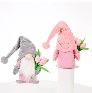 Detailed view of pink and grey tulip gnome plush dolls on white cylindrical pedestals