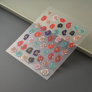 Detail of 5D gold embossed alphabet nail stickers Co-190 with colorful wax seal design