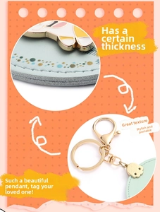 Detail showing the thick mint green leather texture and gold metal clasp of the corgi keychain