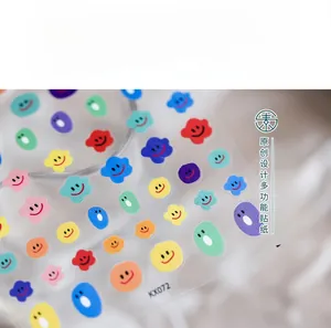 Macro shot of colorful smiley face nail stickers KX072 with ultra-thin adhesive backing