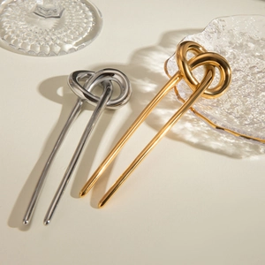 Minimalist U-shaped stainless steel hair pins in gold and silver finish with knot design