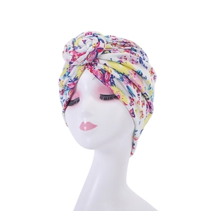 Detail of floral bohemian turban with a 3D rose knot on high elastic fabric